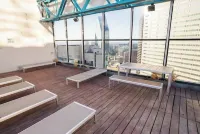 Cozy Retreat with Rooftop Pool, Parking, and Spacious Comfort - Condos