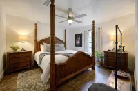 Secluded 4 bedroom farmhouse nestled on 8 acres with large lawn and oak trees.