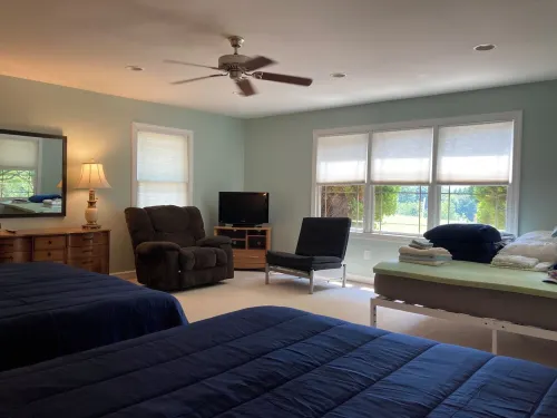 Lake front 2 cottages on private 11 acres: dock, deck, wiffleball, & more