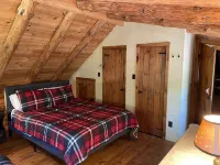 The perfect ADK log cabin getaway on 4 acres and 5 min. to town!