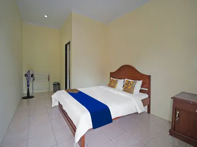 SPOT ON 91910 Arfan House Hotel dekat SIMPANG PUSRI WISATA DANAU RANAU