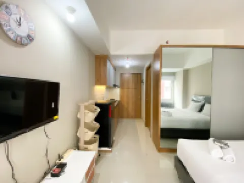 Homey and Cozy Stay Studio LRT City Jatibening Apartment