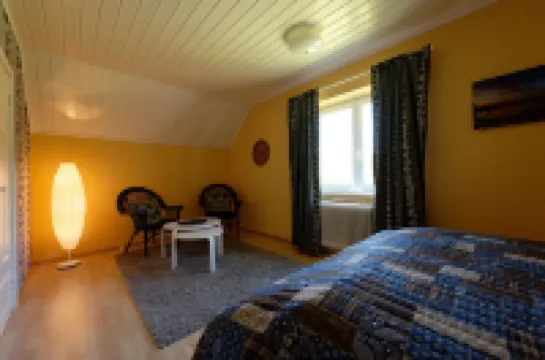 Idyllic sunny lakeside location with only 20 m to the private jetty and boat.