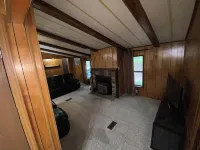 Quiet cabin in the woods w/ access to pools, river, & lakes in gated community!!