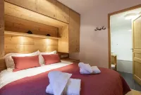 Appart 130m², full services  , 4 bedrooms, 3 bathrooms / d, large south terrace, 2 parking spaces Hotels in Montvalezan