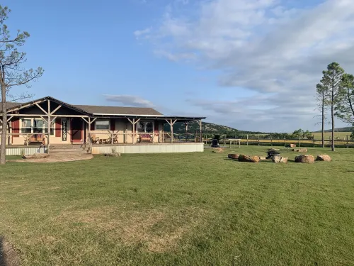 Mountain views, wrap around porch, incredible lawn with fire pit!!