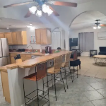 Lagoon shaped pool home with private back yard!