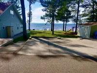 New Listing! Lake front cottage with 100' of private sandy beach