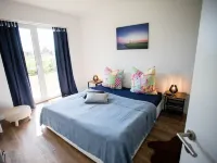 Modern, bright apartment with terrace, directly behind the dike, in the North Sea resort Wremen Hotels in Wremen