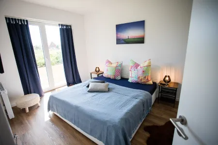 Modern, bright apartment with terrace, directly behind the dike, in the North Sea resort Wremen