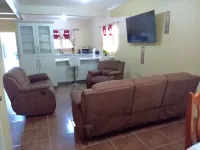 Cozy 3-bedroom townhome in enjoyable Piarco with AC, WiFi Hotels in Piarco