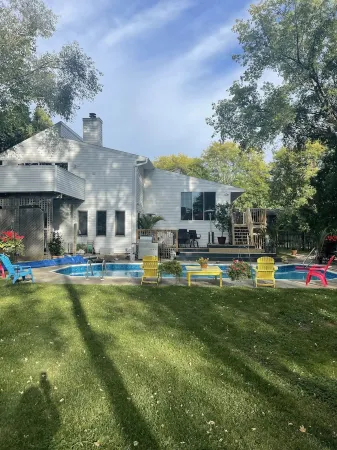 Contemporary home in quiet neighborhood with pool & great back yard close to all