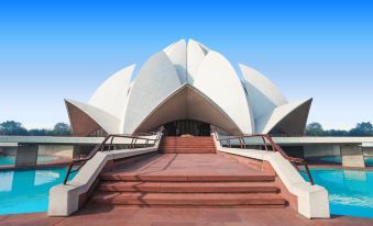 a large white building , possibly a temple or a monument , surrounded by a body of water at Park Inn by Radisson New Delhi Lajpat Nagar