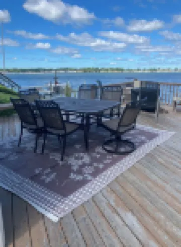 Charming Cottage on the Bay and Golf Course with private patio and boat dock.