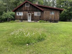 Vintage 1920s Speakeasy Cabin Overlooking the Sandy Shores of Swan Lake!