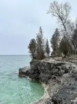 Cozy cottage tucked in the woods. 5 minutes from Cave Point and Whitefish Dunes.