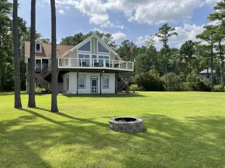 Riverfront Property with Dock and Ramp.  Dolphins, Fish, Boat, Swim & More