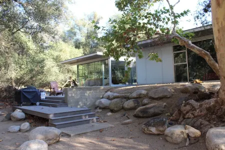 Glass home, with river, night sky & privacy What more can you ask for?