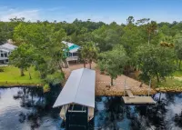 3-bedroom Riverfront home with private boat dock and view of Steinhatchee River.