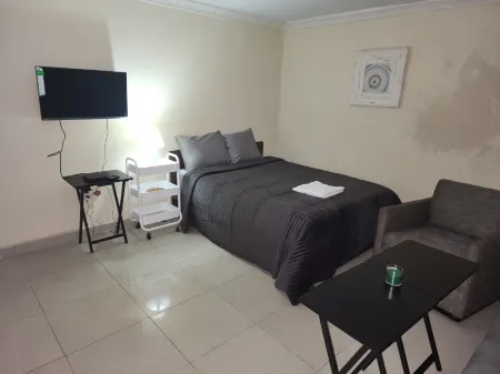 Mike's Flat Hotel Отели в г. Люкенга