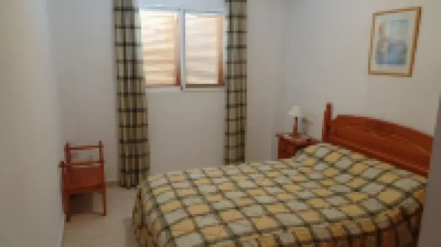 Living room with balcony and sea view, waterfront and south-facing