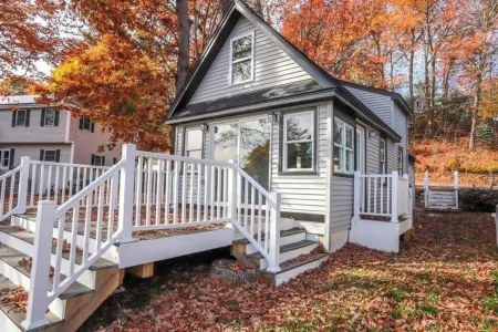 Lakefront; view of ski mountain, firepit, dock, kayaks, paddle board
