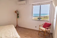 Apartment on the beachfront with parking, pool and gym