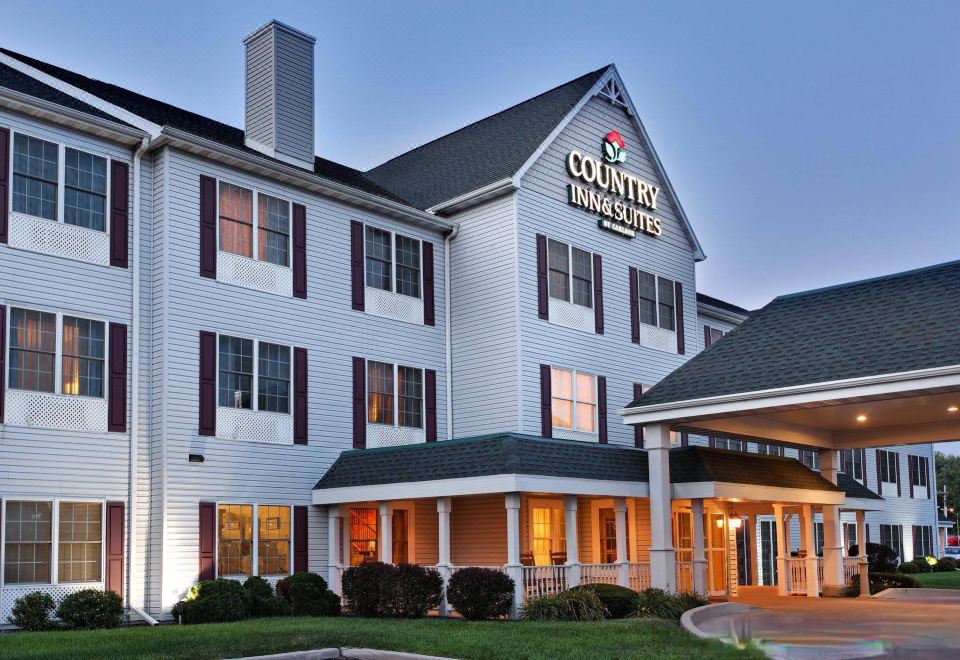"a large white building with a sign that says "" country inn & suites "" is shown" at Country Inn & Suites by Radisson, Rock Falls, IL
