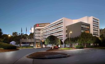 "a large hotel with a white building and the word "" marriott "" prominently displayed on its facade" at Atlanta Marriott Peachtree Corners