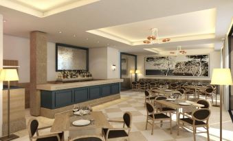 a modern restaurant with a bar and dining area , featuring a large screen on the wall at Bordoy Continental Valldemossa