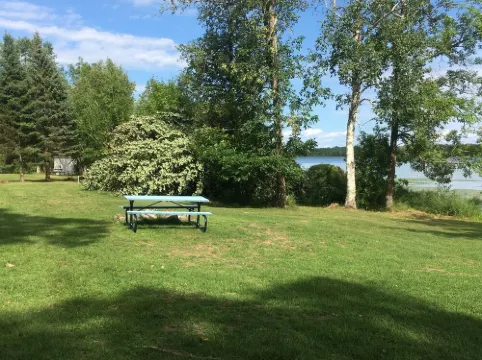 Ferguson Farmhouses on Oak Lake with 176 feet of shoreline in Kerrick Minnesota.