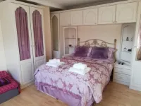 Myrtle Cottage Vacation Rooms - parcheggio