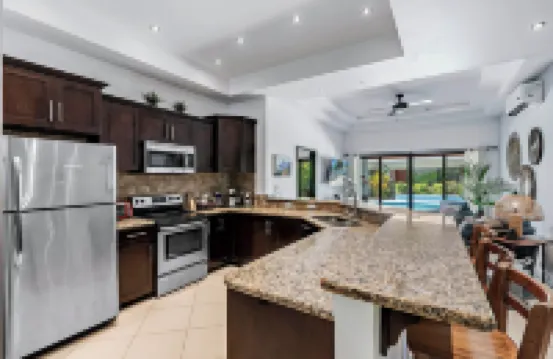 Stylish Home with Chic Decor, Luxury Amenities & Tropical Outdoor Oasis with Sparkling Private Pool