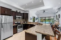 Stylish Home with Chic Decor, Luxury Amenities & Tropical Outdoor Oasis with Sparkling Private Pool