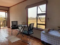 Cozy wooden cabin overlooking the foot of the Tswapong Hills in Palapye.