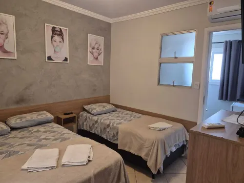 Kitnet com ar na praia das Astúrias - chambre d’hôtes