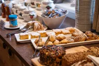 COOEE alpin Hotel Dachstein - servizio colazione