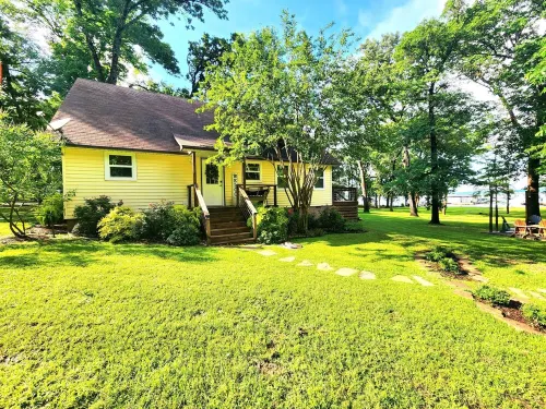 Relaxing Lakefront Home w/ Boat Dock, Fire-Pit and Private Walk-in Beach! Gated