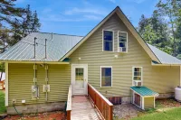 Charming lakefront home with water views, dock & inviting deck
