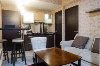 Minimalist 2Br Apartment at Tamansari Papilio Hotels in Gayungan