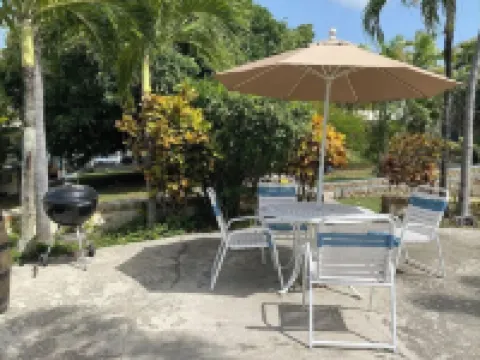 Tropical one bedroom condo steps from pool.
