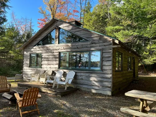 Welcoming 4-bedroom lake front cabin in charming Otis on Beech Hill Pond.
