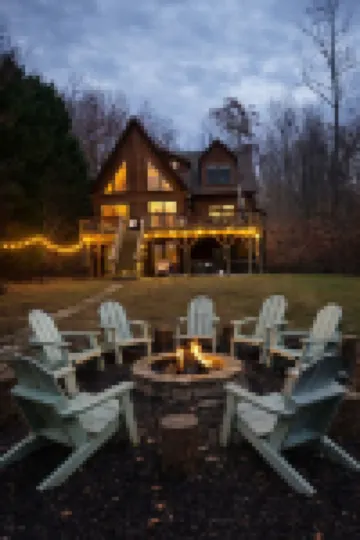 Enchanting 5-Bed/5-Bath Lakefront Log Cabin with Private Cove, Beach & Hot Tub.