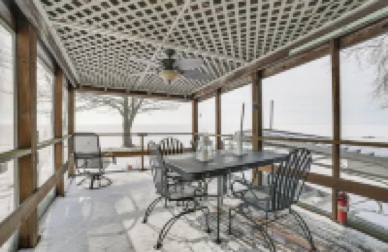 Porch + Views: Waterfront Home on Houghton Lake!