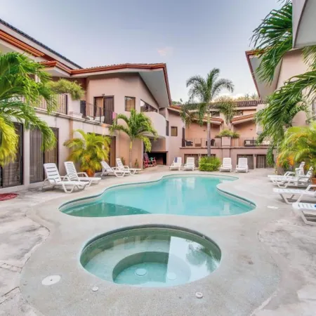 Sunny 2Br: Balcony, Pool, Kitchen, Walk to Beach