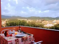 panoramic house surrounded by greenery with parking
