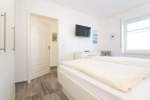 Ferienwohnung im Erdgeschoss für 2 Personen mit Terrasse und Garten in Norden Hotels in Norden