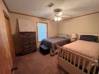 Waterfront house with boathouse, boat launch, outdoor kitchen, fire pit