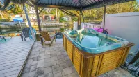 River Home with Huge Arcade, Hot Tub Kayaks, Mini Golf and Floating Pad, 80in TV
