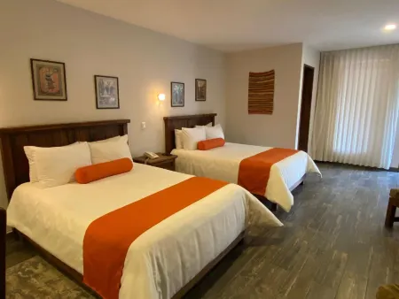 Capital O la Huerta Golf & Hotel Отели в г. Чолула де Ривадабия